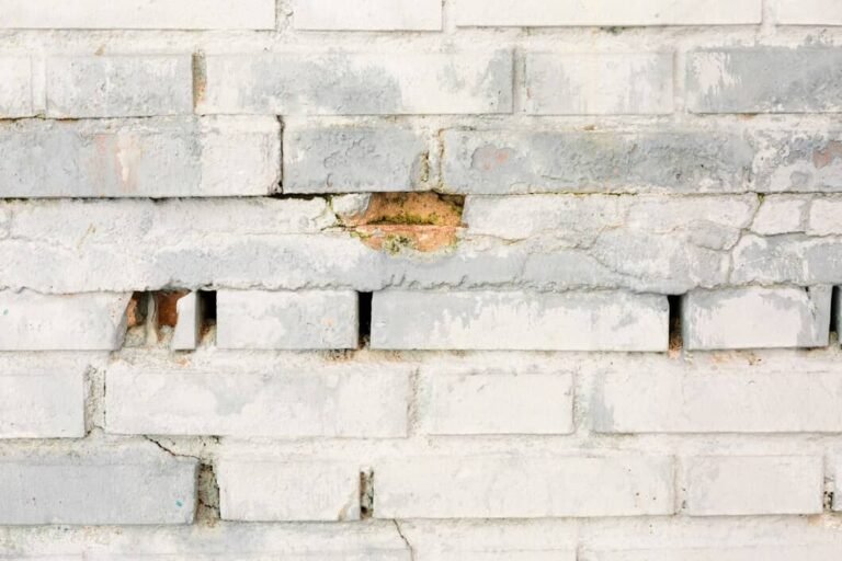 Brick efflorescence removal on exterior masonry wall