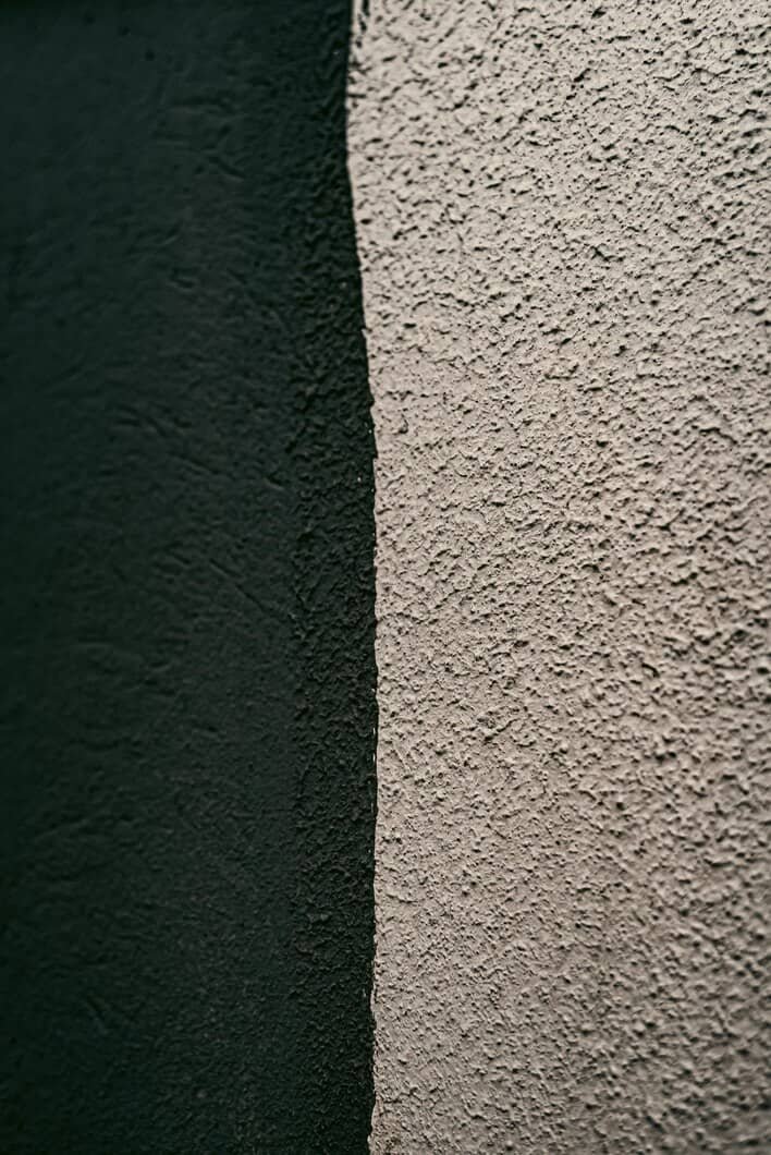 Parging vs stucco exterior wall finish comparison