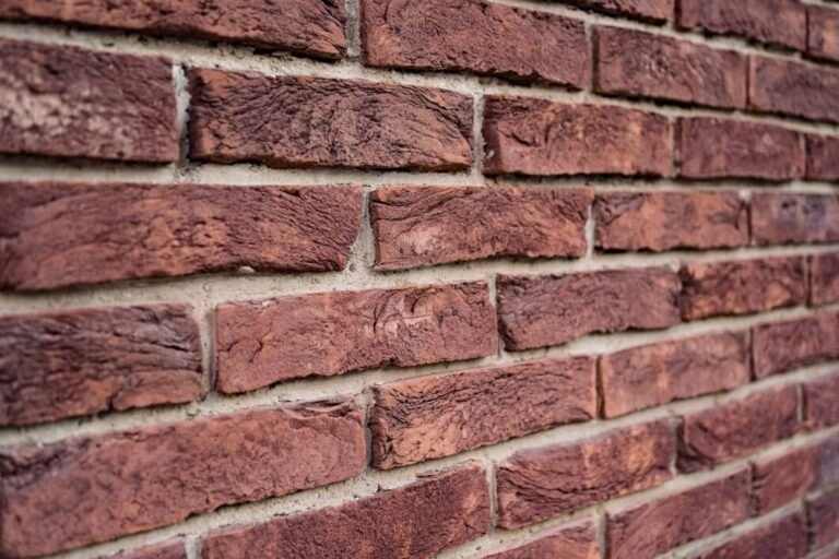 Tuckpointing depth in Oakville brick mortar joint repair
